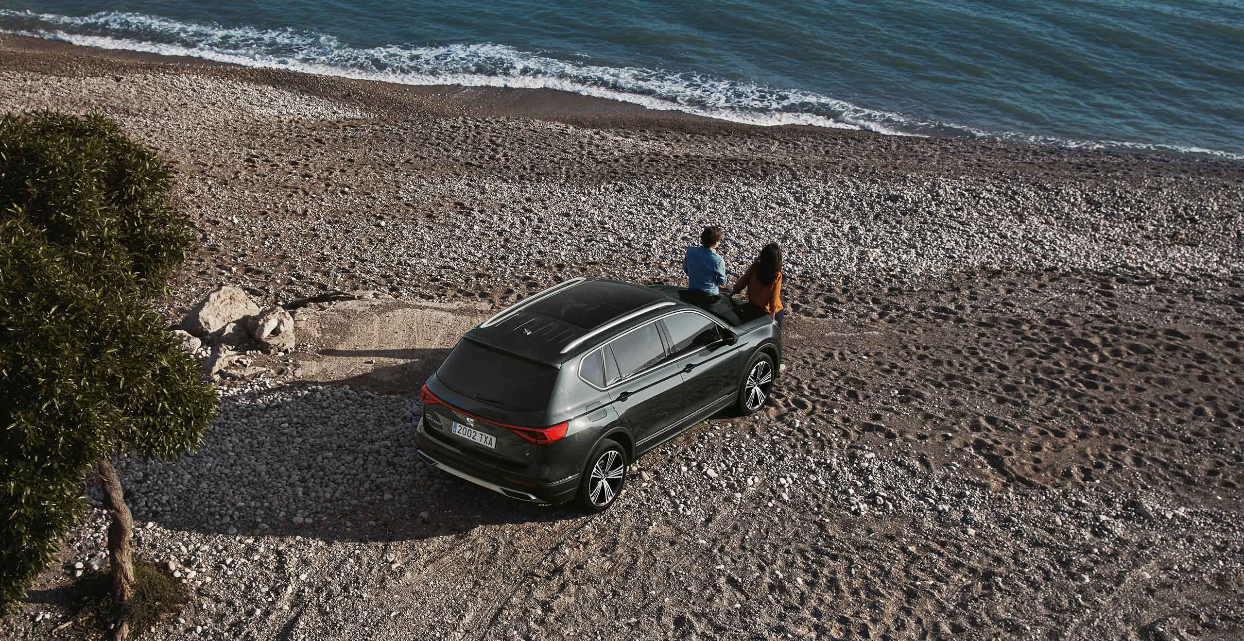 New SEAT Tarraco dark camouflage colour parked at the beach