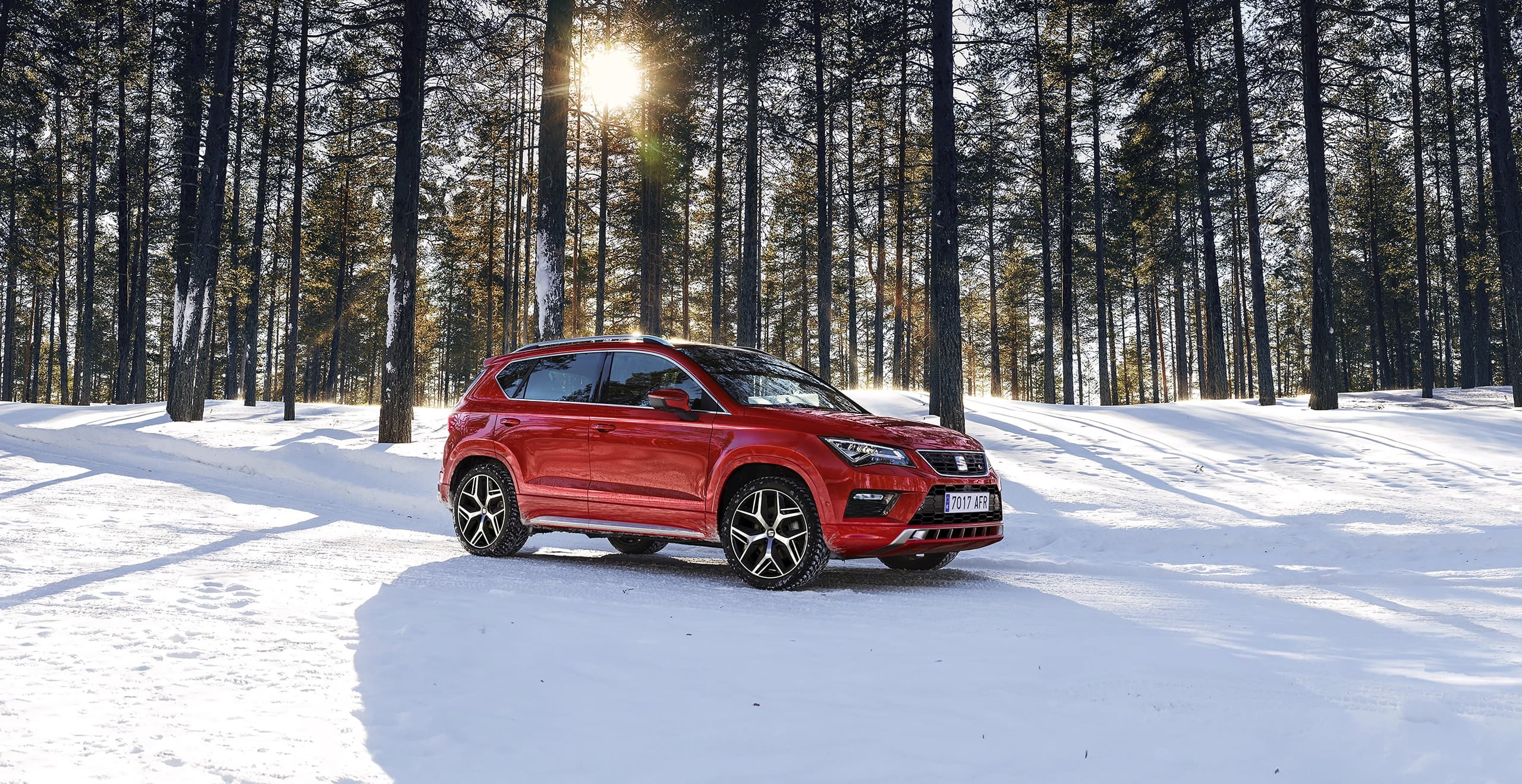 SEAT new car services and maintenance – Countryside view of a car driving at speed on an empty road